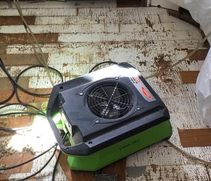Air mover drying flooring.